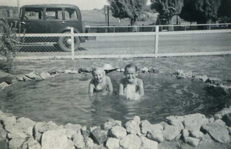 The Robinson children having fun in Tiger’s pond. Tiger’s 1937 Hilman Minx behind.
