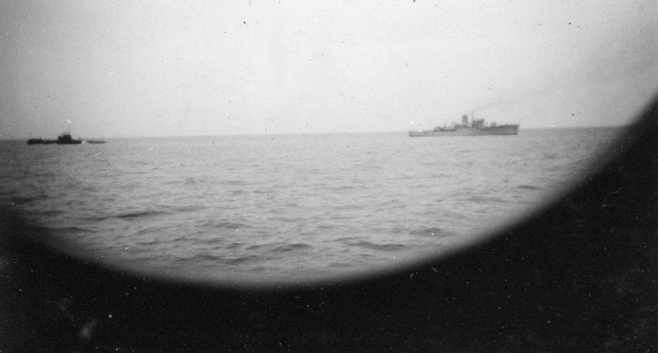 Through the scuttle – exercising off Rottnest with the submarine HMS Thorough. Thorough is to the left and Mildura to the right.