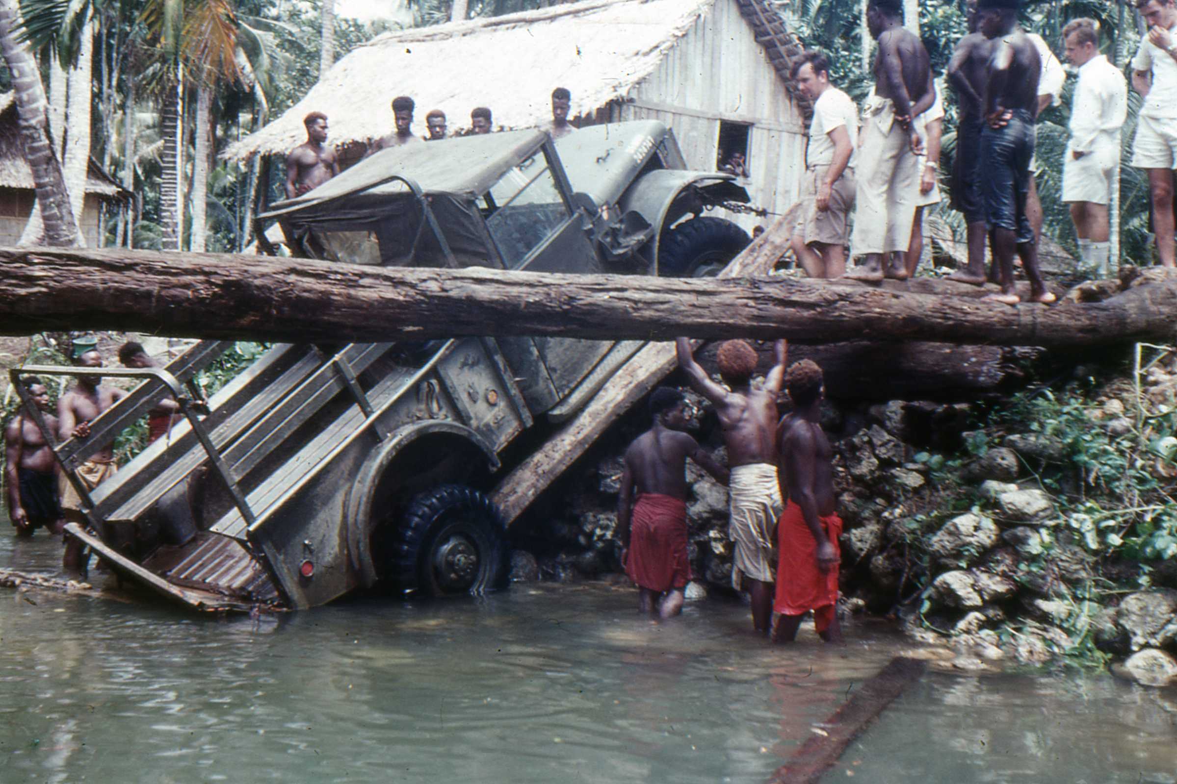 Winching the ‘Iron Horse with native boi help from the creek bed and a destroyed bridge