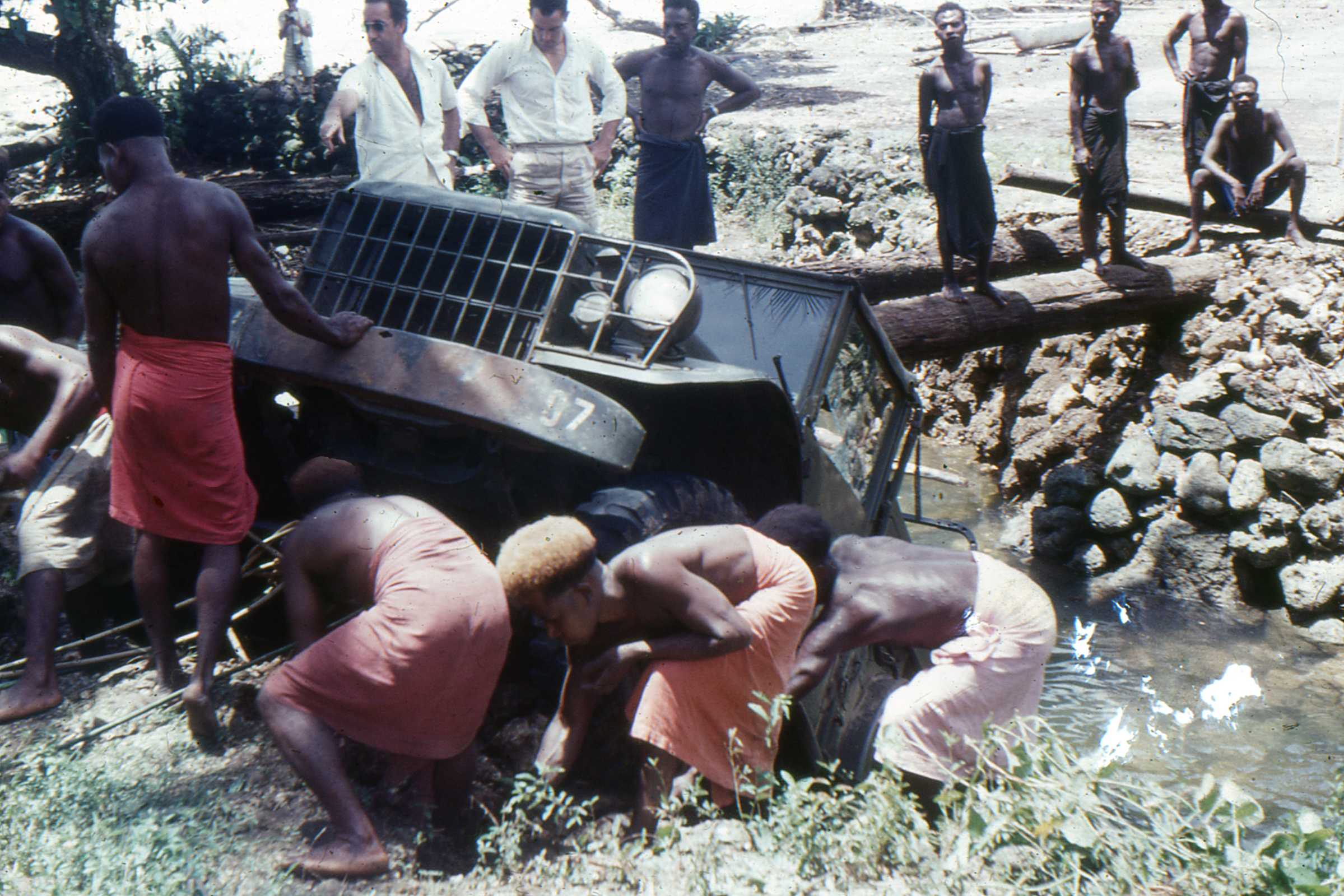Winching the ‘Iron Horse with native boi help from the creek bed and a destroyed bridge