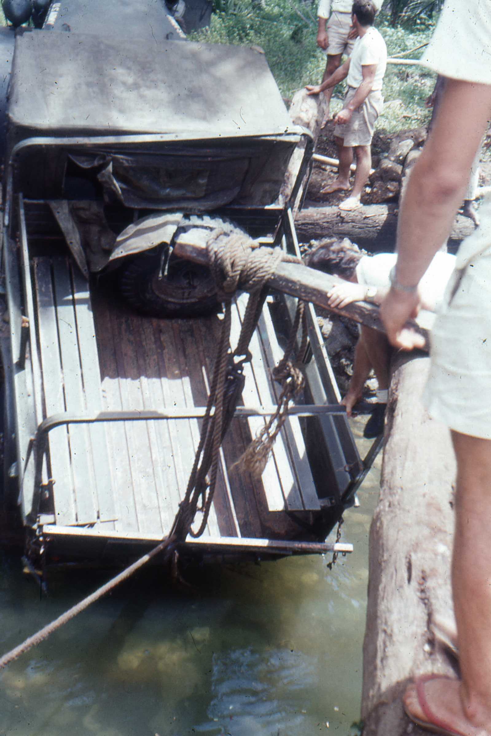 Winching the ‘Iron Horse with native boi help from the creek bed and a destroyed bridge