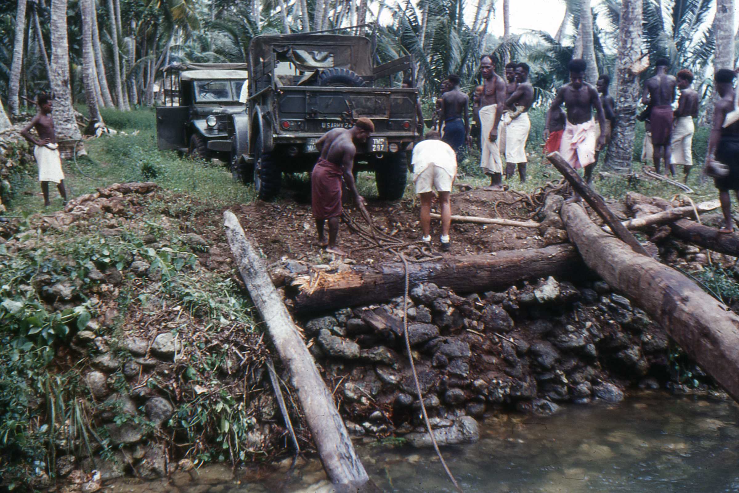Winching the ‘Iron Horse with native boi help from the creek bed and a destroyed bridge