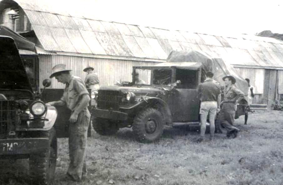 Namatanai – loading Pat Wood, Bernie, Peter Quonset hut behind