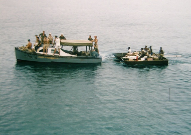 The J Boat towing two landing craft