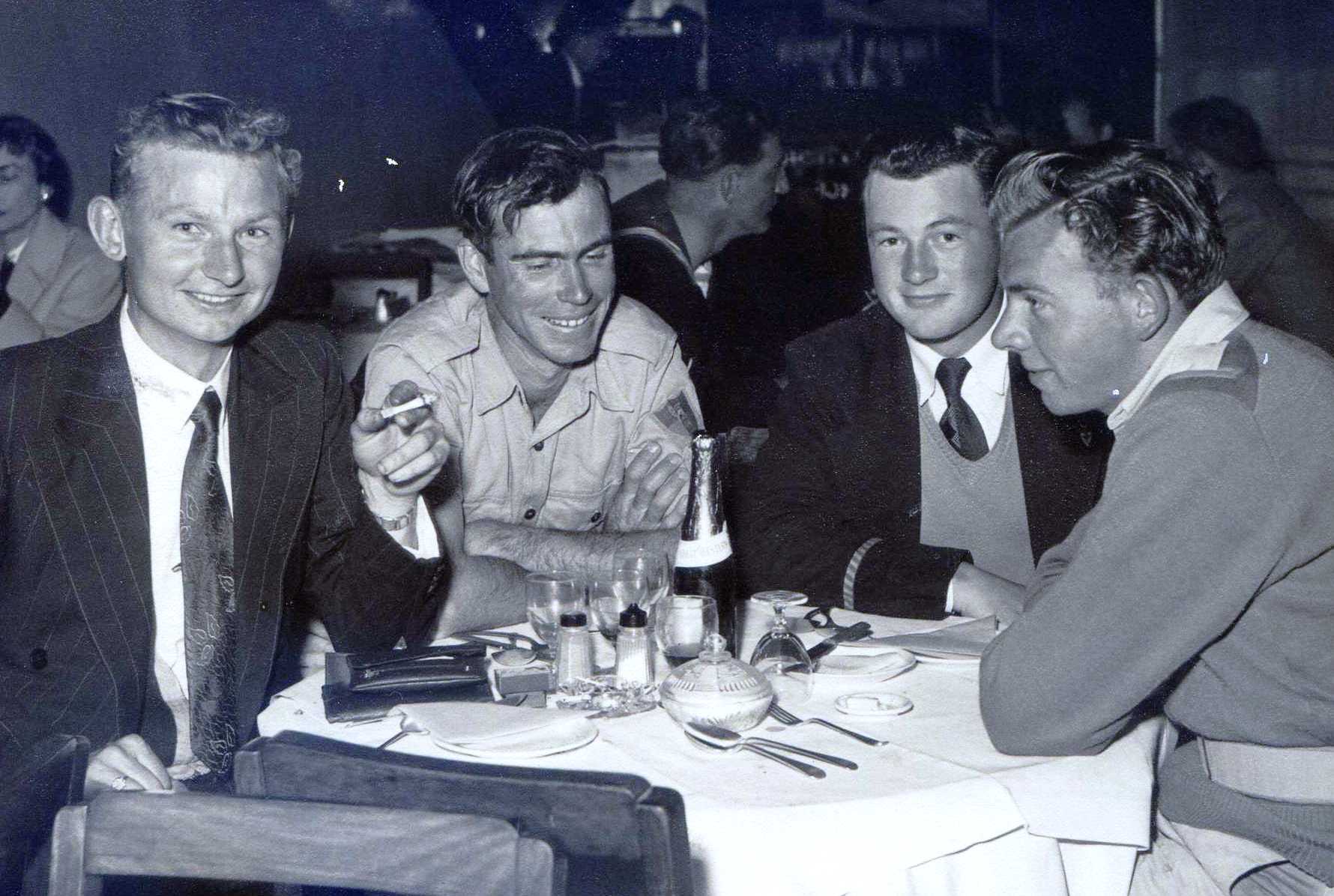 Celebrating a Melbourne Cup win at the Silver grill of the Australia Hotel. Spr Skitch, Georger Ullinger, John Etheredge. I am wearing my navy blue pin stripe suit and have taken to smoking.