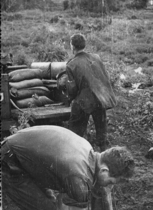 Sergeant Dave King and Sapper Derek Chambers filling sand bags