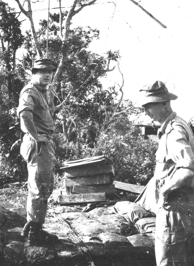 Atop the hill feature Nui Dat Sgt Stan Campbell and Capt Bob Skitch consider where to position AASV 001.